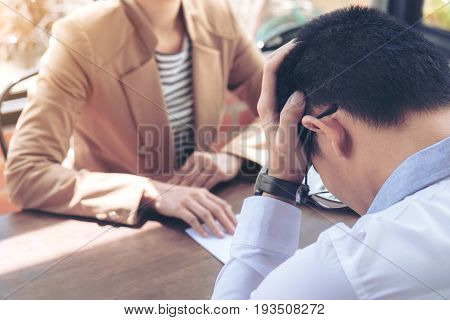 Close up of the hand employer filing final remuneration to employee Man has stressed Resignation resign concept.