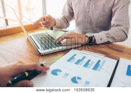 Co working conference Business team meeting present investor colleagues discussing new plan financial graph data on office table with laptop and calculator Finance accounting investment.