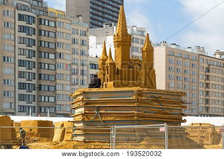 OSTENDE BELGIUM - JUNE 9 2017: Preparation for Sand Sculpture Festival. Sculptures from sand in the course of creation