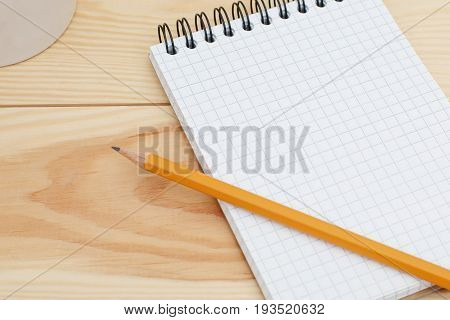Blank Spiral Notebook With Pencil Laying On Wooden Desk. Modern Designer Home Desk Table With Blank