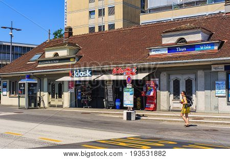 Thun, Switzerland - 21 July, 2015: a building housing a Kiosk on Seestrasse street in the city of Thun, a person passing along. Thun is a city and municipality in the administrative district of Thun in the Swiss canton of Bern.