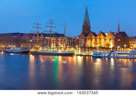 Night view of the Weser River and Protestant Lutheran Saint Martin Church in the old town of Bremen, Germany.