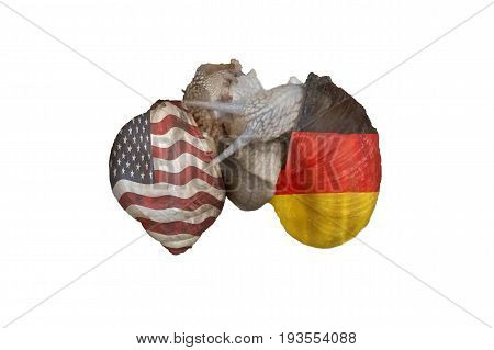 Two vine snails at Lovemaking. On the snail shells once the flag of America and on the other the German national flag. Concept German American Friendship.