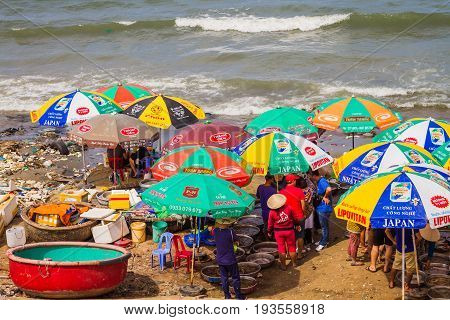 Muine Vietnam - May 26 2017: Unidentified People Shopping In The Seafood Fresh Market At Muine Pier In Muine Vietnam.
