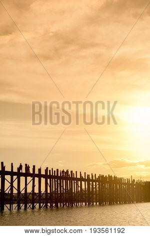 Ubein bridge World longest wooden bridge at sunrise at Taungthaman Lake Amarapura Mandalay Myanmar Burma