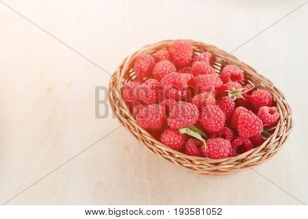 Fresh Summer Raspberry In A Basket. Selective Focus.