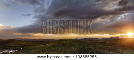 Sunset in the steppe a beautiful evening sky with clouds plato Ukok no one around Altai Siberia Russia