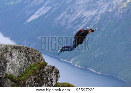Skydiving over beautiful Norway. Clouds, sun and sky