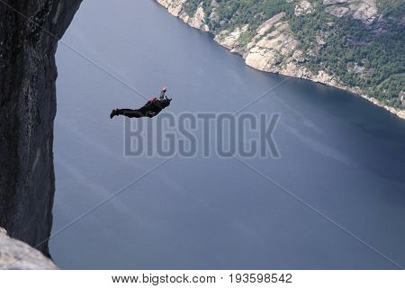 Skydiving over beautiful Norway. Clouds, sun and sky