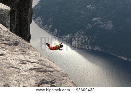 Skydiving over beautiful Norway. Clouds, sun and sky