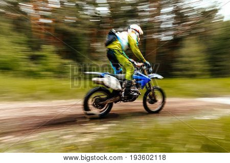 championship motocross in forest blurred motion motorcycle enduro