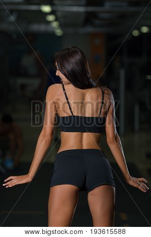 Sexy woman in sportswear back view. Active lifestyle. Attractive female athlete in fitness club