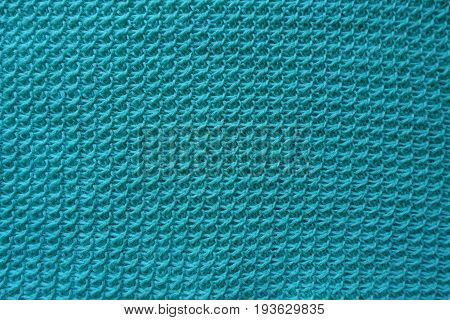 Homemade motton blue knitted fabric from above