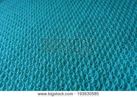Relief stitches on motton blue handmade knitwork