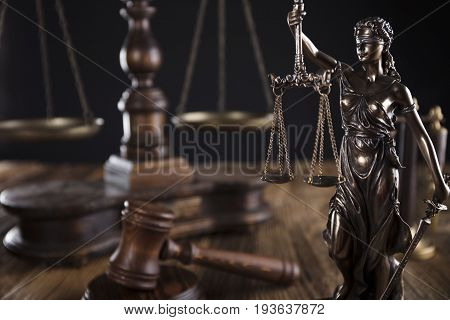 Justice concept, Themis, gavel and scale on wooden table.