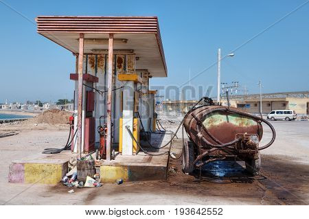 Hormuz Island Hormozgan Province Iran - 17 april 2017: A rusty tank stands near a small petrol station.