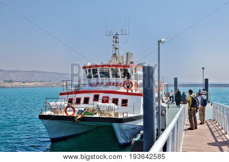 Hormuz Island Hormozgan Province Iran - 17 april 2017:Tourists come to the passenger ship that runs between the island and Bandar Abbas.