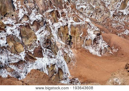 Hormuz Island Hormozgan Province Iran - 17 april 2017: Iranian Island of Hormuz in Persian Gulf The tourist looks at the crystals of salt in the salt mountains.