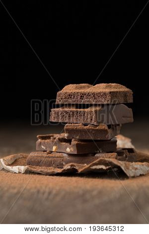 Pieces of chocolate on paper