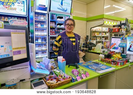 SEOUL, SOUTH KOREA - CIRCA JUNE, 2017: worker at CU convenience store. CU is a convenience store franchise chain in South Korea.