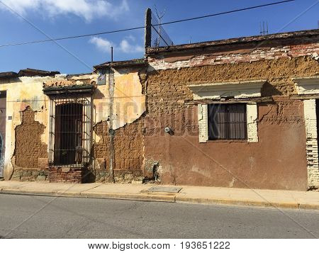 OAXACA, OAXACA, MEXICO- JUNE 17, 2017: Abandoned house made of adobe on a street in Oaxaca, Mexico