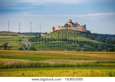 Rupea Romania - June 23 2013: Old medieval fortress on top of the hill Rupea village located in Transylvania Romania