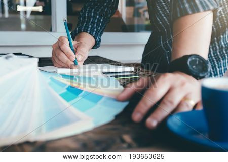 Architect Or  Interior Designer Selects Color Tones For House Project