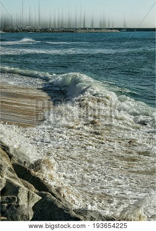 tour of a quiet wave on a beach without sand