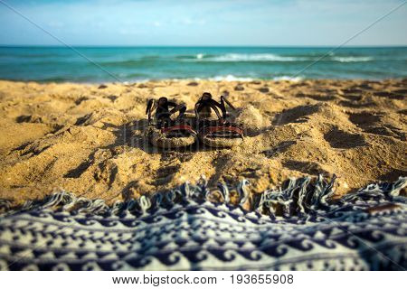 Summer Footwear And Plaid On The Sand Beach, Closeup Summer Vacation Concept