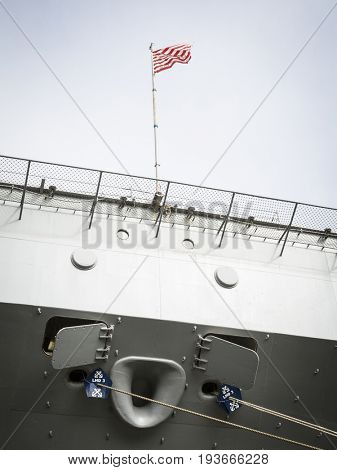 Ship Tour USS Kearsarge (LHD 3) Wasp-class amphibious assault ship: Traditional First Navy Jack Flag, Dont Tread On Me, waves from the bow. Fleet Week NEW YORK MAY 25 2017.