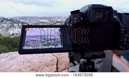 Camera shoots photo timelapse of the Jerusalem Old City view landscape. Mount Scopus is a famous Holy Land place and it has a fantastic view to the Old Jerusalem.