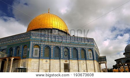 Clouds over Dome of the Rock in Jerusalem over the Temple Mount. Golden Dome is the most known mosque and landmark in Jerusalem and sacred place for all muslims.