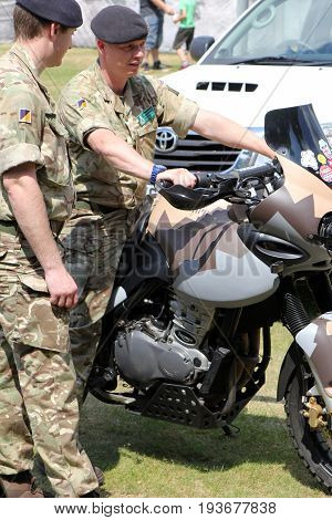 Sandhurst, Surrey, Uk - June 18Th 2017: Two British Army Motorcyclists With Triumph Motorbike At The