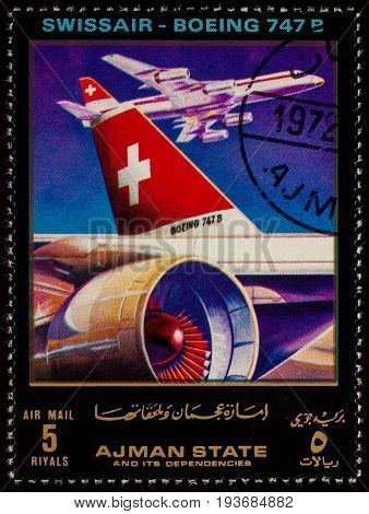 Moscow Russia - July 03 2017: A stamp printed in Ajman shows passenger airliner Boeing 747B Swissair series 