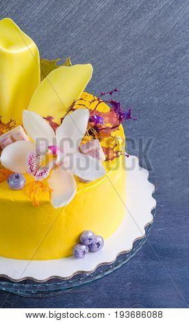 yellow cream cheese cake with chocolate twist and isomalt decoration