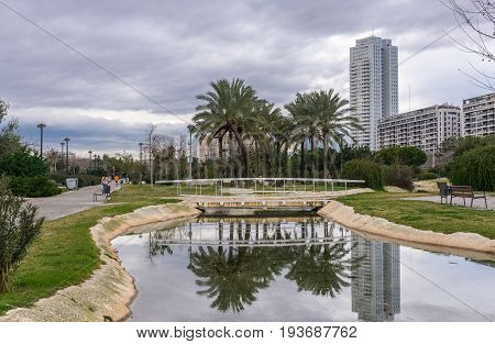Turia River gardens Jardin del Turia, leisure and sport area. Pedestrian walk way and artificial water channel. Valencia, Spain