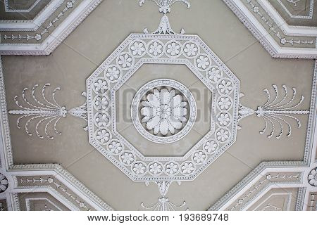 Ornate plaster ceiling decoration. Classical decorative plasterwork.