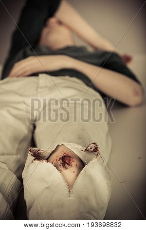 Teenage Boy Awaiting Treatment For A Knee Injury