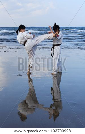 Kagawa, Japan - January 3, 2017: Japanese martial arts houses, young girls training of karate at the new year at the Ichinomiya beach.