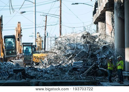 ATLANTA, GA - APRIL 2017:  A huge pile of debris sits where a section of I-85 South was imploded and knocked down following the collapse of the I-85 North bridge from a fire in Atlanta GA on April 1 2017.