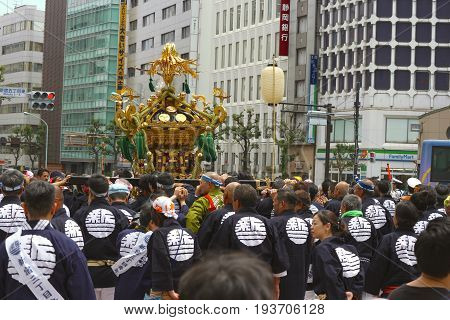 2017 05 28. SHINJUKU TOKYO JAPAN. People are carrying a portable shrine on their shoulders and walking around shinjuku city. known as OMIKOSHI MASTURI FESTIVAL at HANAZONO JINJA, SHINJUKU TOKYO JAPAN