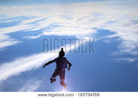 Skydiving over beautiful Norway. Clouds, sun and sky