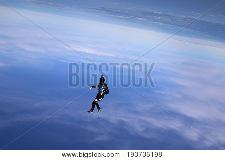 Skydiving over beautiful Norway. Clouds, sun and sky