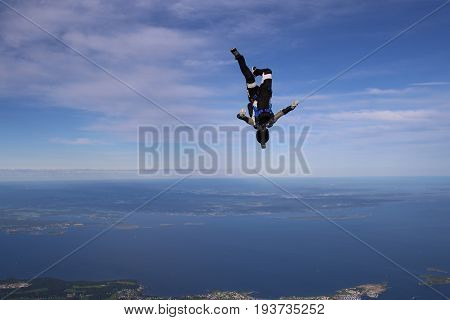Skydiving over beautiful Norway. Clouds, sun and sky