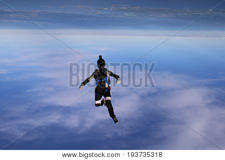Skydiving over beautiful Norway. Clouds, sun and sky