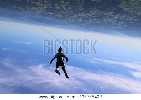 Skydiving over beautiful Norway. Clouds, sun and sky
