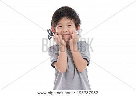Asian Chld  Holding Two Fidget Spinners