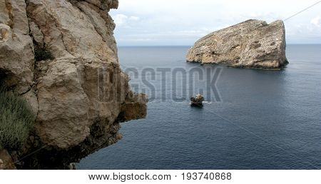 Alghero - Sardinia (Italy). Neptune's Cave - Panoramic shot of Foradada Isle view from Escala del Cabirol