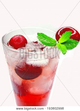 red cherry juice in glass with ice and mint