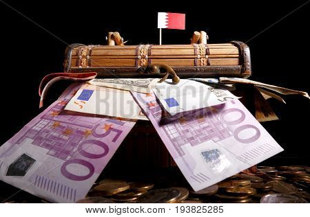 Bahraini Flag On Top Of Crate Full Of Money